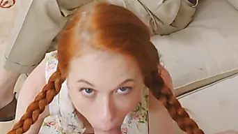 Redhead slut with pigtails sucks an older man's hard dick