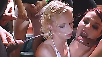 No way!? Kinky redhead and slutty blonde get pissed on at bukkake party