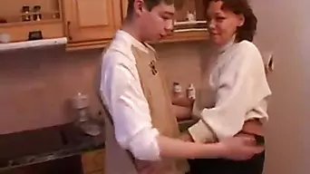 Stepmom and stepson have a sex on the kitchen