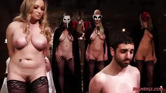 A group of hot dominas who are wearing masks and slutty lingerie