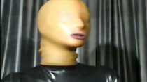 Lovely girl in latex mask posing