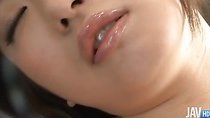 Akane Ozora loves cosplay and she dresses up in a French maid outfit with red fishnet thigh highs before using a mini vib on her pussy