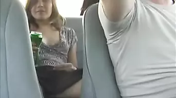 Busty girl gives head in the car