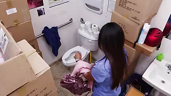 Camera hidden in toilet films her pussy while she stuffs it with pants!